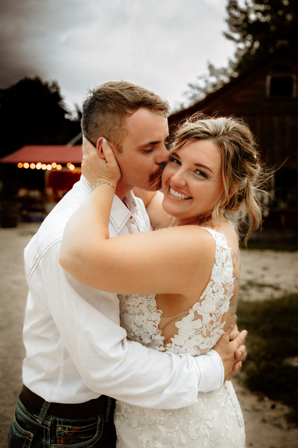 bride and groom portraits in front of barn at Mulberry Lane Farms Venue