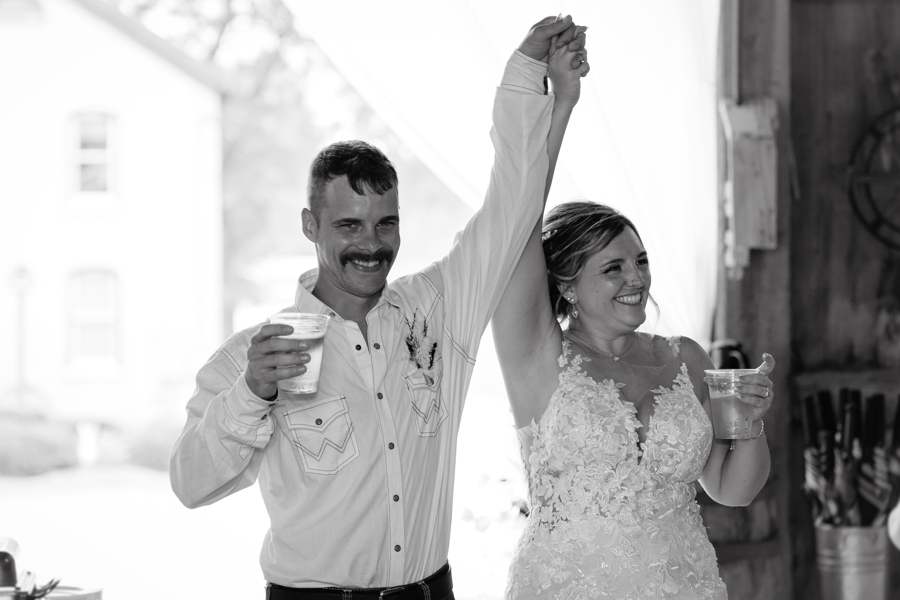 bride and groom entering barn at  Mulberry Lane Farms Venue in Wisconsin