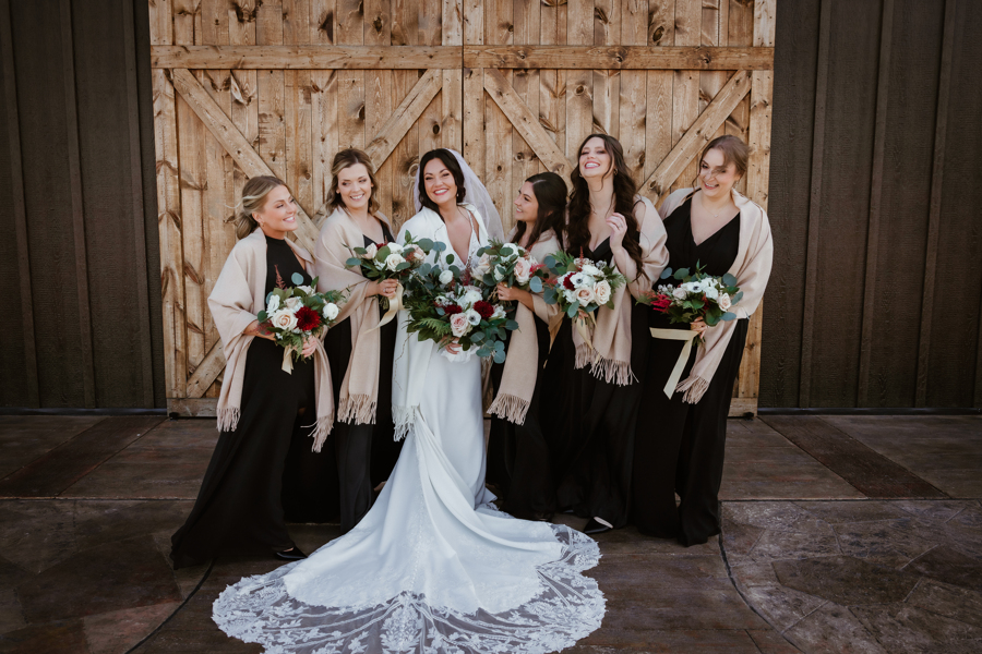 bridesmaid photo in front of The Barn at Sunset Acres