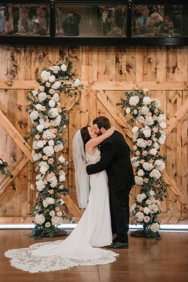 bride and groom first kiss at bride and groom photo in Wisconsin