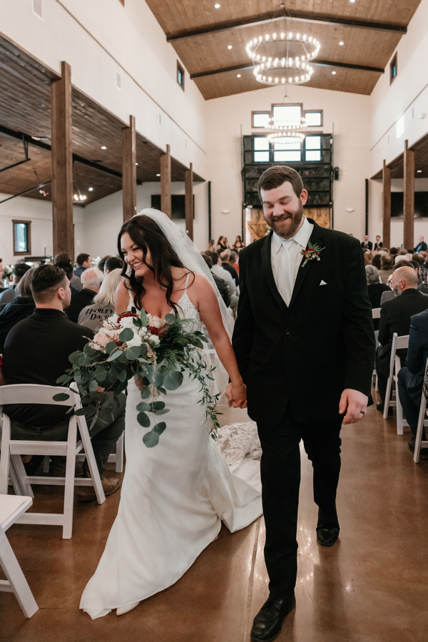 bride and groom walking down the aisle after ceremony 