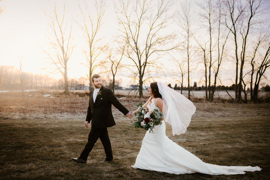 bride and groom walking around the The Barn at Sunset Acres