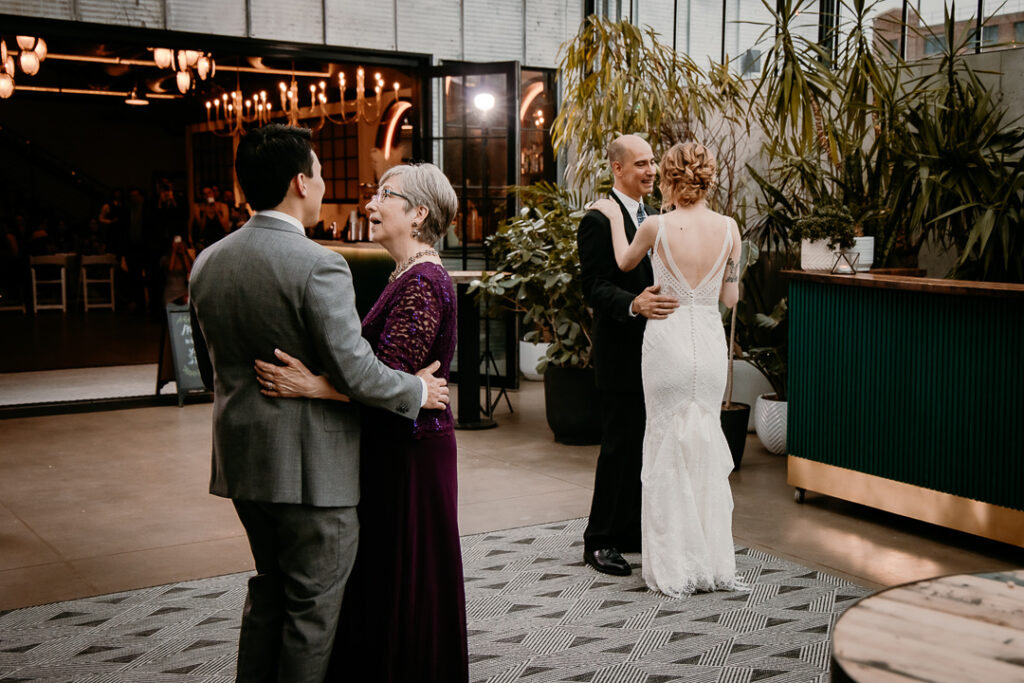 Bride and Groom celebrating their wedding at The Tinsmith in Madison, Wisconsin