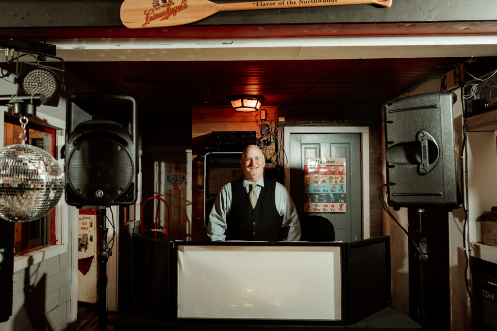 Two brides share a joyful moment during their wedding at the Old Schoolhouse in Merrimac, Wisconsin.
