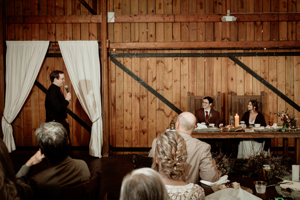 Toasts during wedding reception at Burlap and Bells in Black River Falls, WI