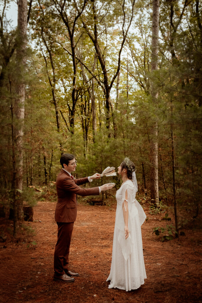 Bride and Groom smudging their ceremony space at Burlap and Bells in Black River Falls, WI