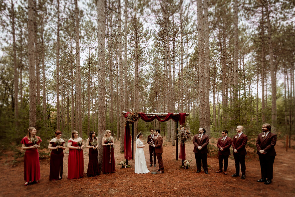 Woodland wedding ceremony at Burlap and Bells in Black River Falls, WI