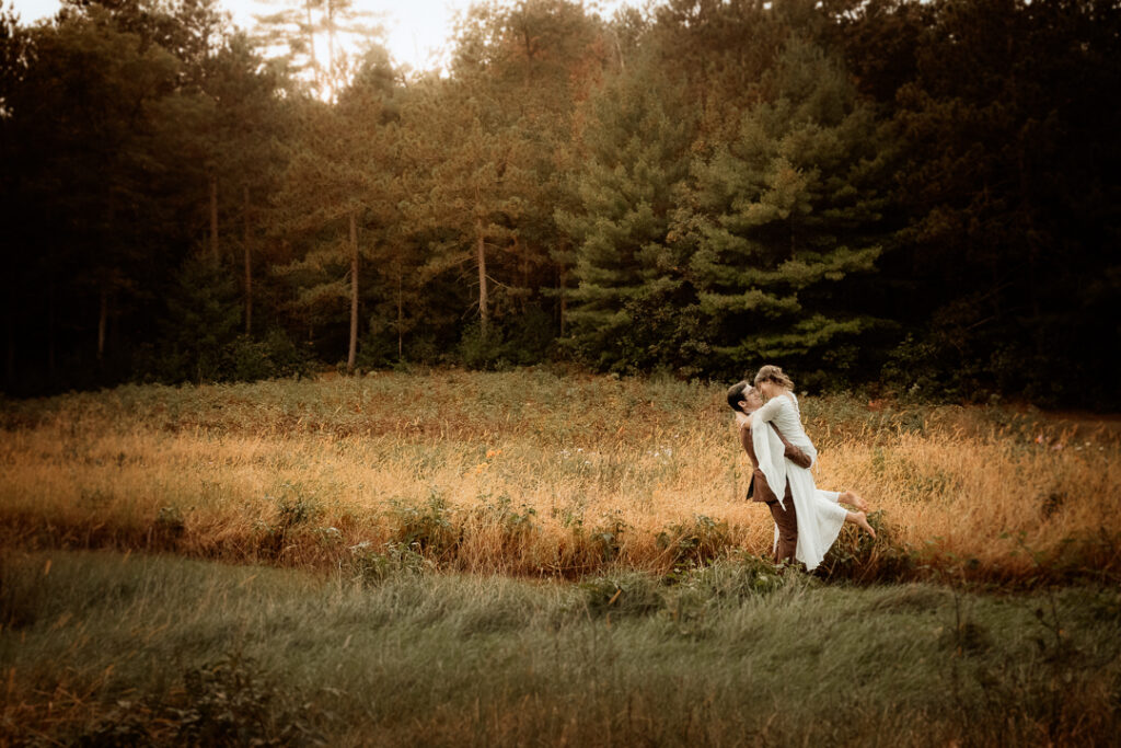 Bride and Groom celebrating their wedding during golden hour at Burlap and Bells in Black River Falls, WI