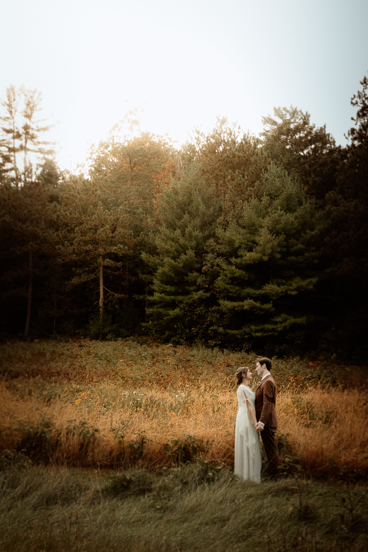 Bride and Groom celebrating their wedding during golden hour at Burlap and Bells in Black River Falls, WI