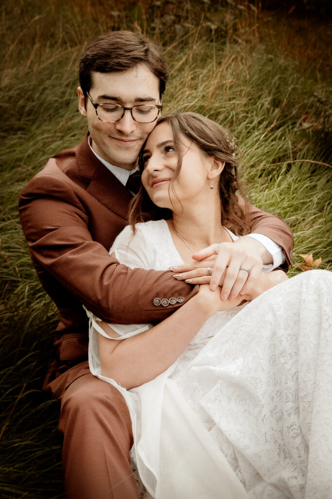 Bride and Groom celebrating their wedding during golden hour at Burlap and Bells in Black River Falls, WI