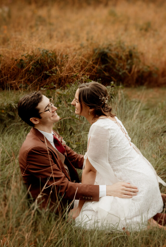 Bride and Groom celebrating their wedding during golden hour at Burlap and Bells in Black River Falls, WI