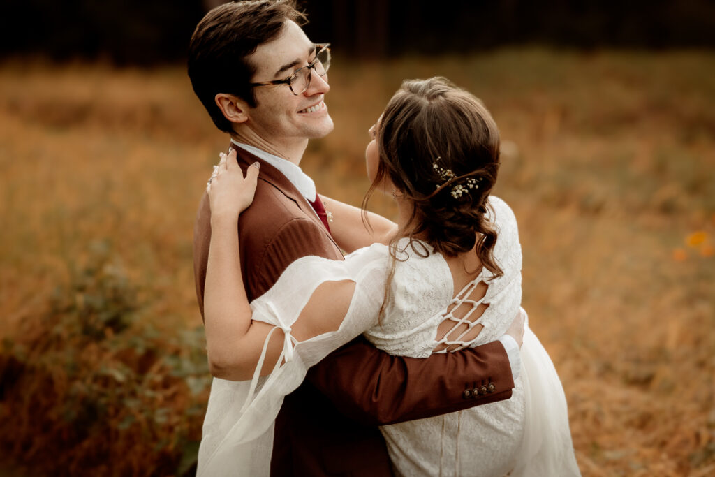 Bride and Groom celebrating their wedding during golden hour at Burlap and Bells in Black River Falls, WI