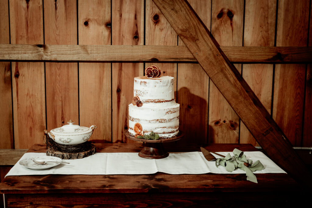 Bride and Groom's cake cutting during their reception at Burlap and Bells in Black River Falls, WI