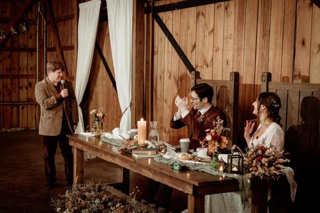 Toasts during wedding reception at Burlap and Bells in Black River Falls, WI